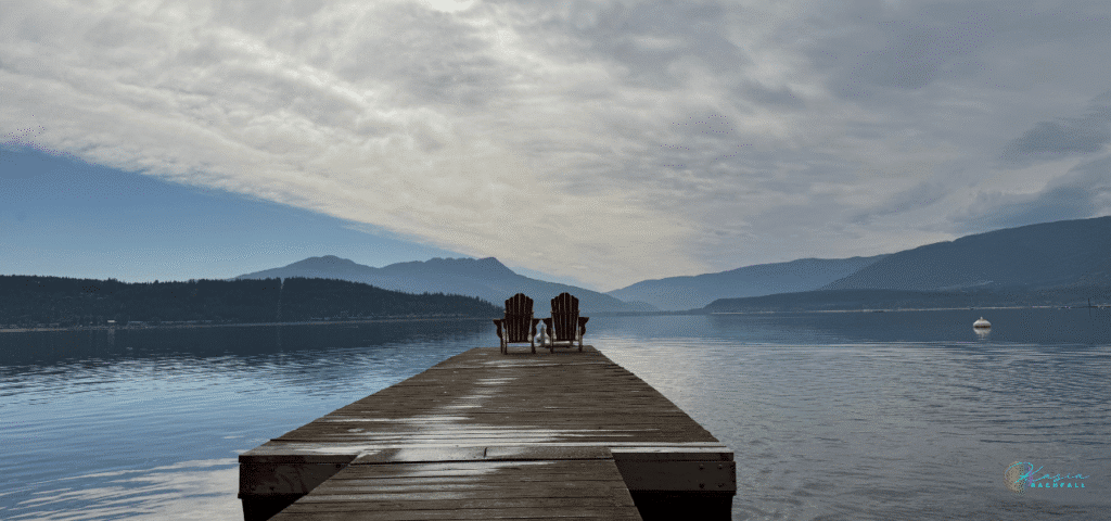 Two chairs by the lake symbolizing nervous system regulation and somatic healing